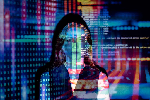 A woman with code projected on her